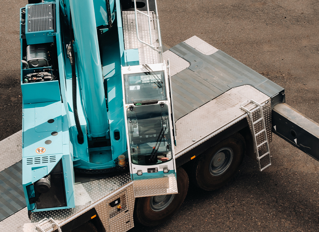 cab-with-operator-large-blue-car-crane-that-stands-ready-operate-hydraulic-supports-platform-large-modern-building-largest-truck-crane-solving-complex-tasks